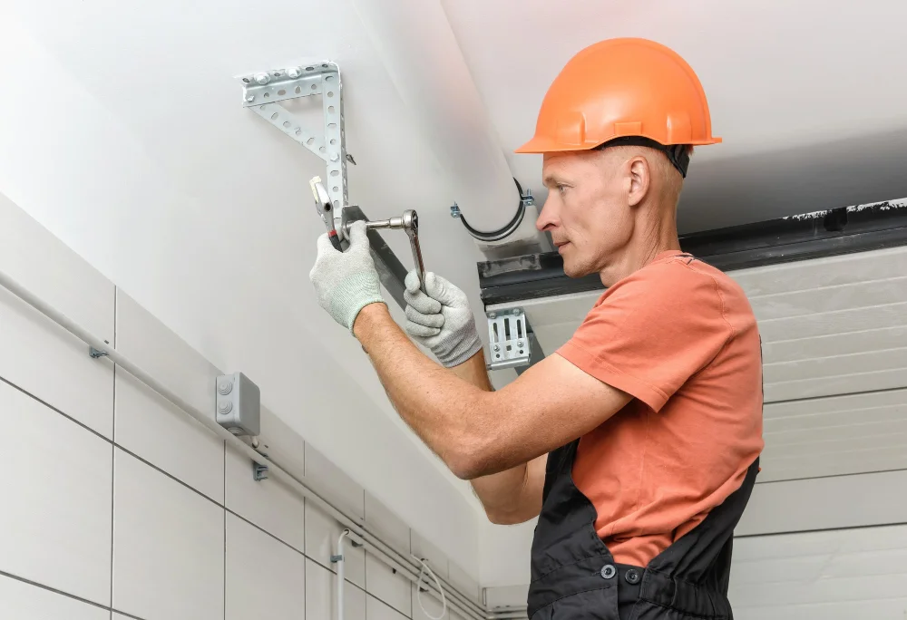 worker repair garage door