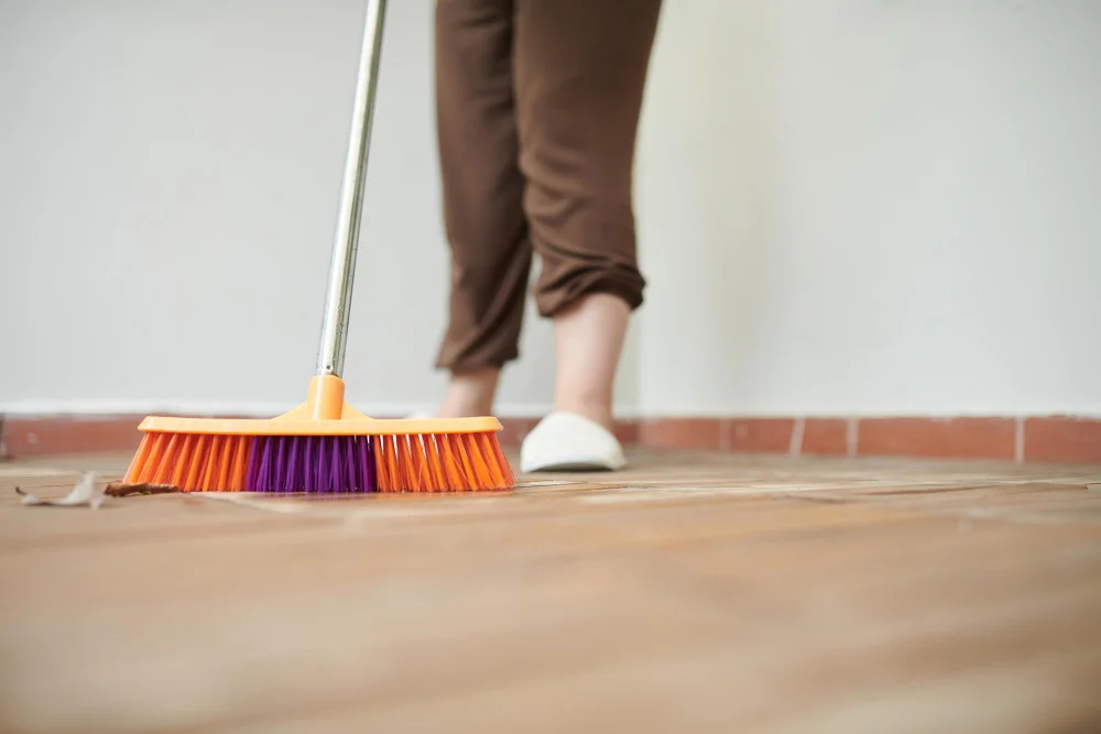 Cleaning Garage with Broom Brush